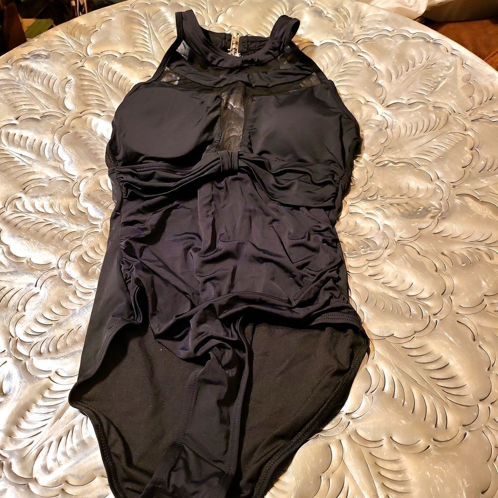 Beautiful brand new one piece bathing suit sz.small black in color,very slimmin